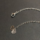 Collana girocollo 12 mini pendenti in acciaio - Fiore gotico