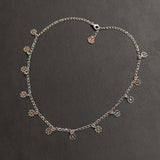 Collana girocollo 12 mini pendenti in acciaio - Fiore gotico