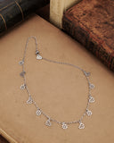 Collana girocollo 12 mini pendenti in acciaio - Cuore e fiore gotico