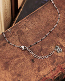 Collana base in acciaio con black beads - chiusura fiore