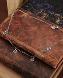 Collana girocollo in acciaio con 6 mini pendenti Cuore