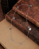 Collana girocollo in acciaio con 6 mini pendenti Cuore e Fiore gotico