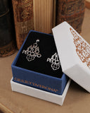 Orecchini a lobo in acciaio Ama il tuo peccato