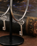 Orecchini cerchio in acciaio - Chiave cuore