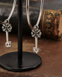 Orecchini cerchio in acciaio - Chiave fiore gotico