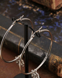 Orecchini cerchio in acciaio - Fiore gotico