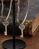 Orecchini cerchio "cuore" in acciaio - Chiave cuore