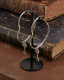 Orecchini cerchio "cuore" in acciaio - Chiave fiore gotico