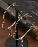 Orecchini cerchio "cuore" in acciaio - Chiave fiore gotico