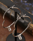 Orecchini cerchio "cuore" in acciaio - Rosone