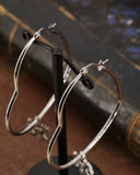 Orecchini cerchio "cuore" in acciaio - Fiore gotico