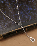 Collana stile rosario in acciaio - Fiore gotico e lucchetto