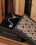 Collana stile rosario in acciaio - Fiore gotico e lucchetto