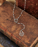 Collana stile rosario in acciaio - Rosone e lucchetto cuore traforato