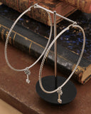 Orecchini cerchio grande diamantato in acciaio - Chiave fiore gotico