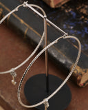 Orecchini cerchio grande diamantato in acciaio - Chiave fiore gotico