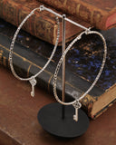 Orecchini cerchio medio diamantato in acciaio - Chiave cuore