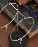 Orecchini cerchio medio diamantato in acciaio - Chiave cuore