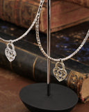 Orecchini cerchio medio diamantato in acciaio - Lucchetto cuore traforato