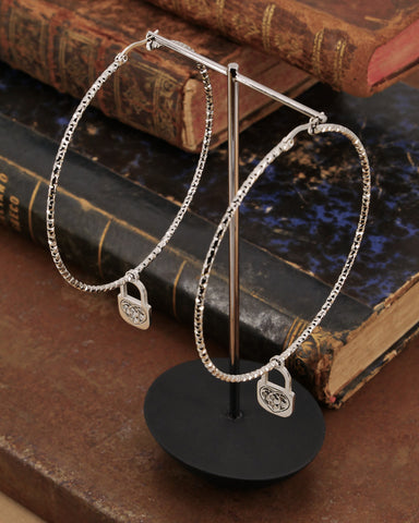 Orecchini cerchio medio diamantato in acciaio - Lucchetto