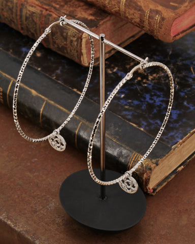 Orecchini cerchio medio diamantato in acciaio - Rosone