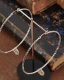 Orecchini cerchio medio diamantato in acciaio - Rosone