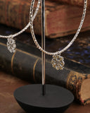 Orecchini cerchio medio diamantato in acciaio - Fiore gotico